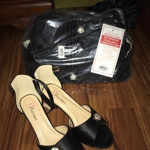 Black short heals with matching handbag